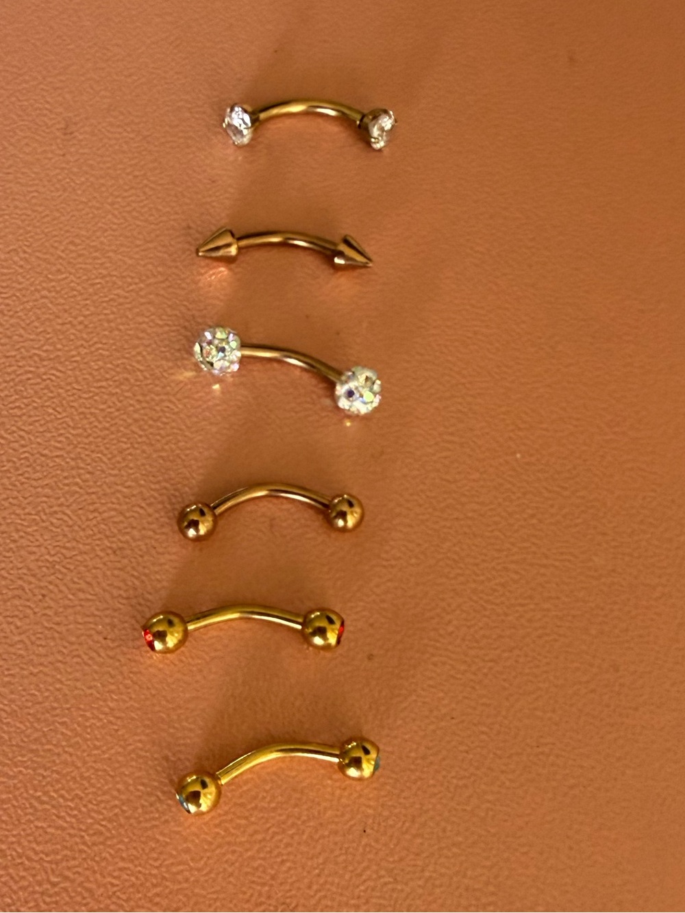 Gold Curved Barbell Belly Rings with Colored Gem Accents